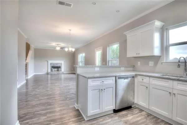 a kitchen with sink cabinets and window