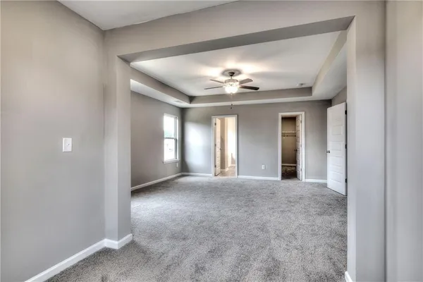 a view of a hallway with a chandelier