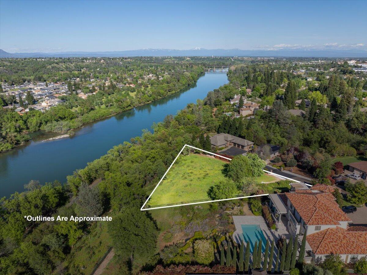 802 Palatine Court Redding, CA 96001 - Photo 3 of 12 an aerial view of lake and residential houses with outdoor space