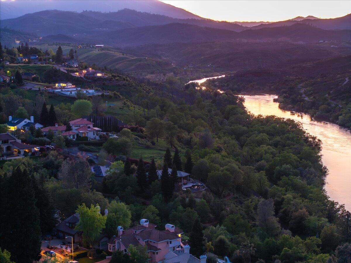 802 Palatine Court Redding, CA 96001 - Photo 9 of 12 a view of a house with a garden