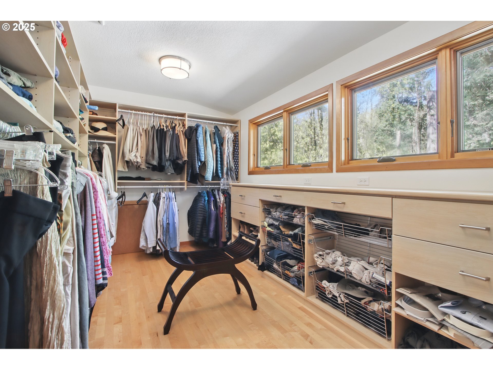 6335 Northwest Cornell Road Portland, OR 97210 - Photo 22 of 41 a view of walk in closet with clothes and shoes