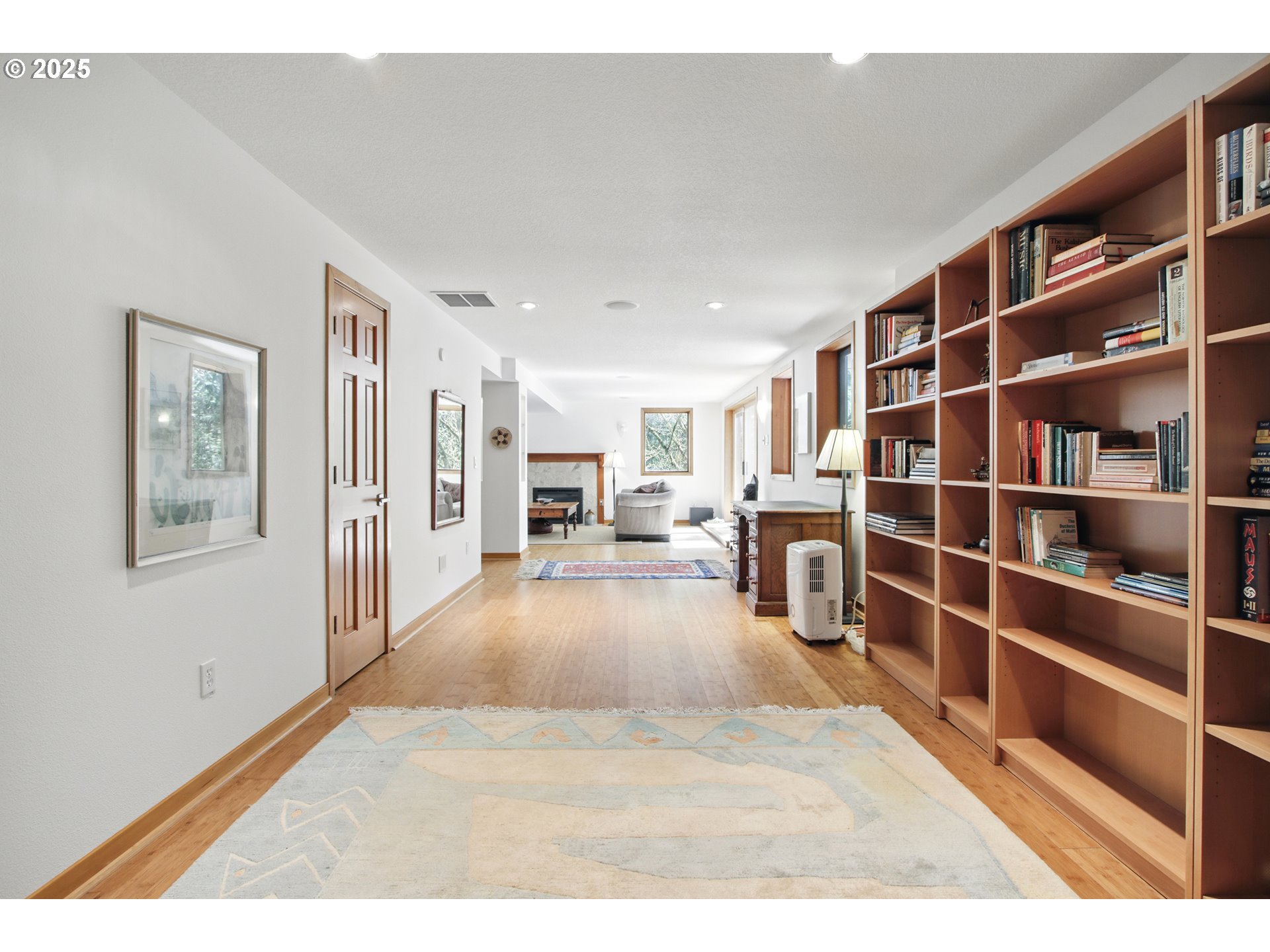 6335 Northwest Cornell Road Portland, OR 97210 - Photo 31 of 41 a living room with furniture and a book shelf