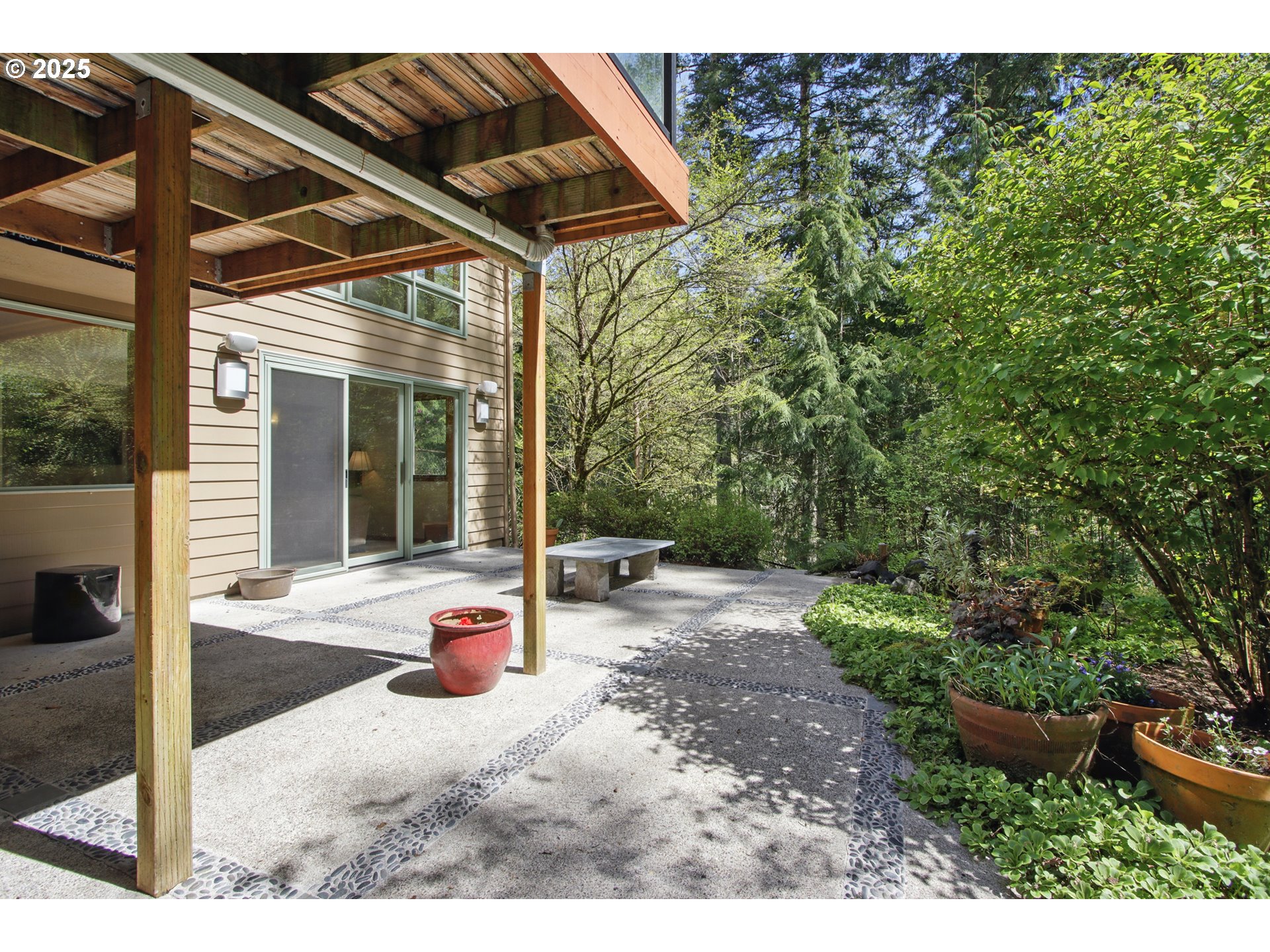 6335 Northwest Cornell Road Portland, OR 97210 - Photo 34 of 41 a view of a backyard with plants and patio