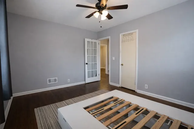 a bedroom with bed and window