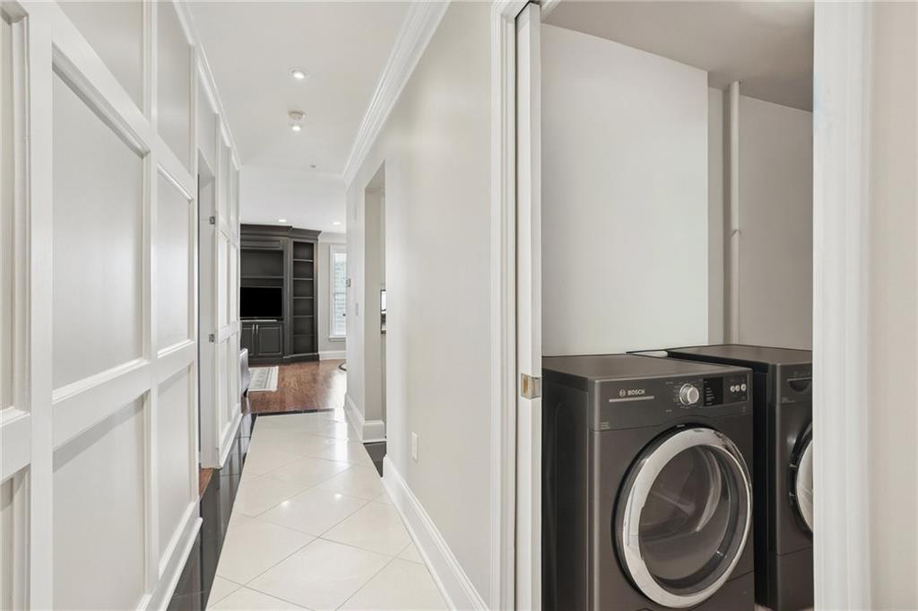 3334 Peachtree Road Northeast, Unit 1109 Atlanta, GA 30326 - Photo 13 of 27 a view of a hallway with washer and dryer