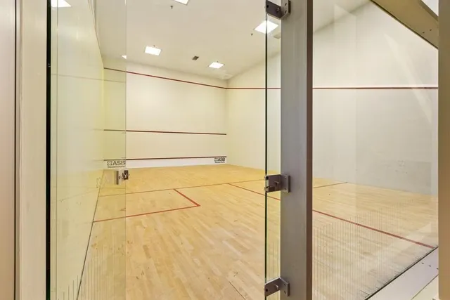 a living room with lots of furniture and white walls