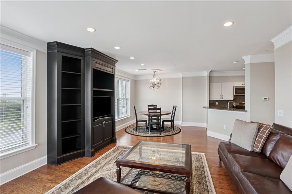 3334 Peachtree Road Northeast, Unit 1109 Atlanta, GA 30326 - Photo 5 of 27 a living room with furniture and a window