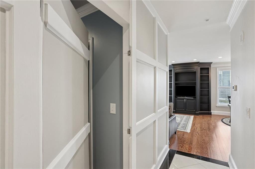 3334 Peachtree Road Northeast, Unit 1109 Atlanta, GA 30326 - Photo 6 of 27 a view of a hallway with wooden floor and staircase