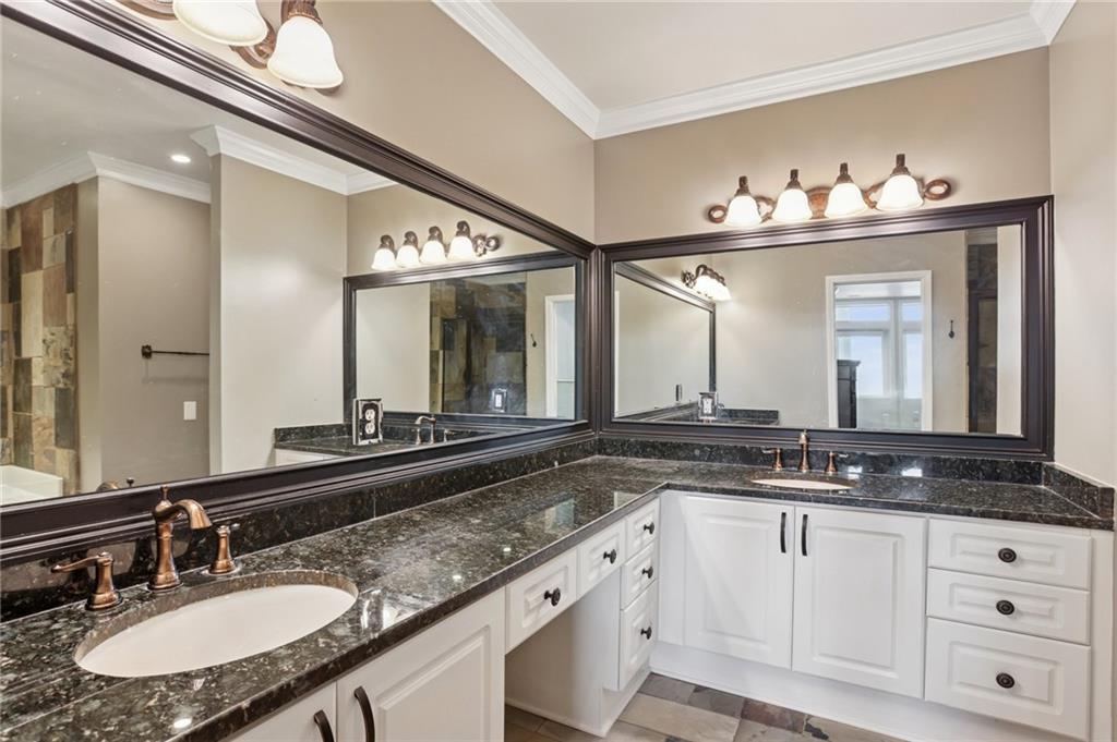3334 Peachtree Road Northeast, Unit 1109 Atlanta, GA 30326 - Photo 9 of 27 a bathroom with a sink and a mirror