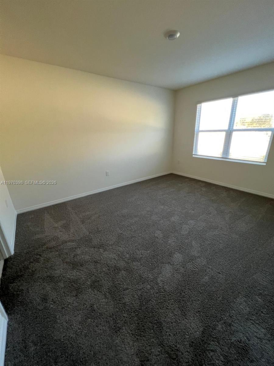 2710 Trinidad Road Haines City, FL 33844 - Photo 3 of 13 an empty room with a window