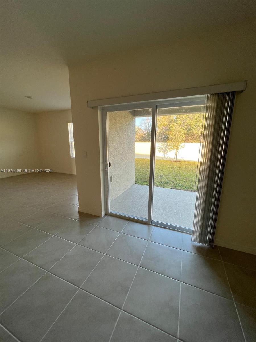 2710 Trinidad Road Haines City, FL 33844 - Photo 7 of 13 a view of an empty room and window