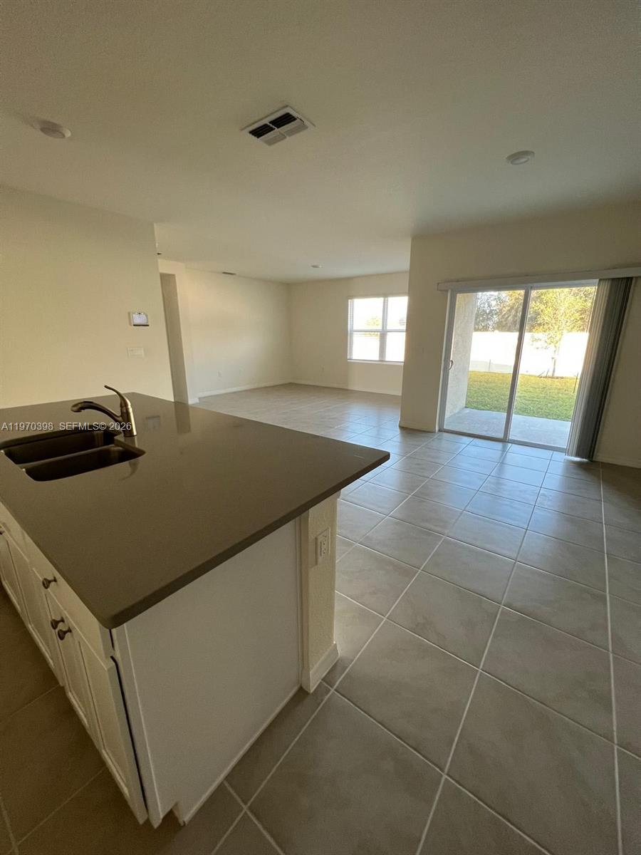 2710 Trinidad Road Haines City, FL 33844 - Photo 9 of 13 a kitchen with a sink appliances and cabinets