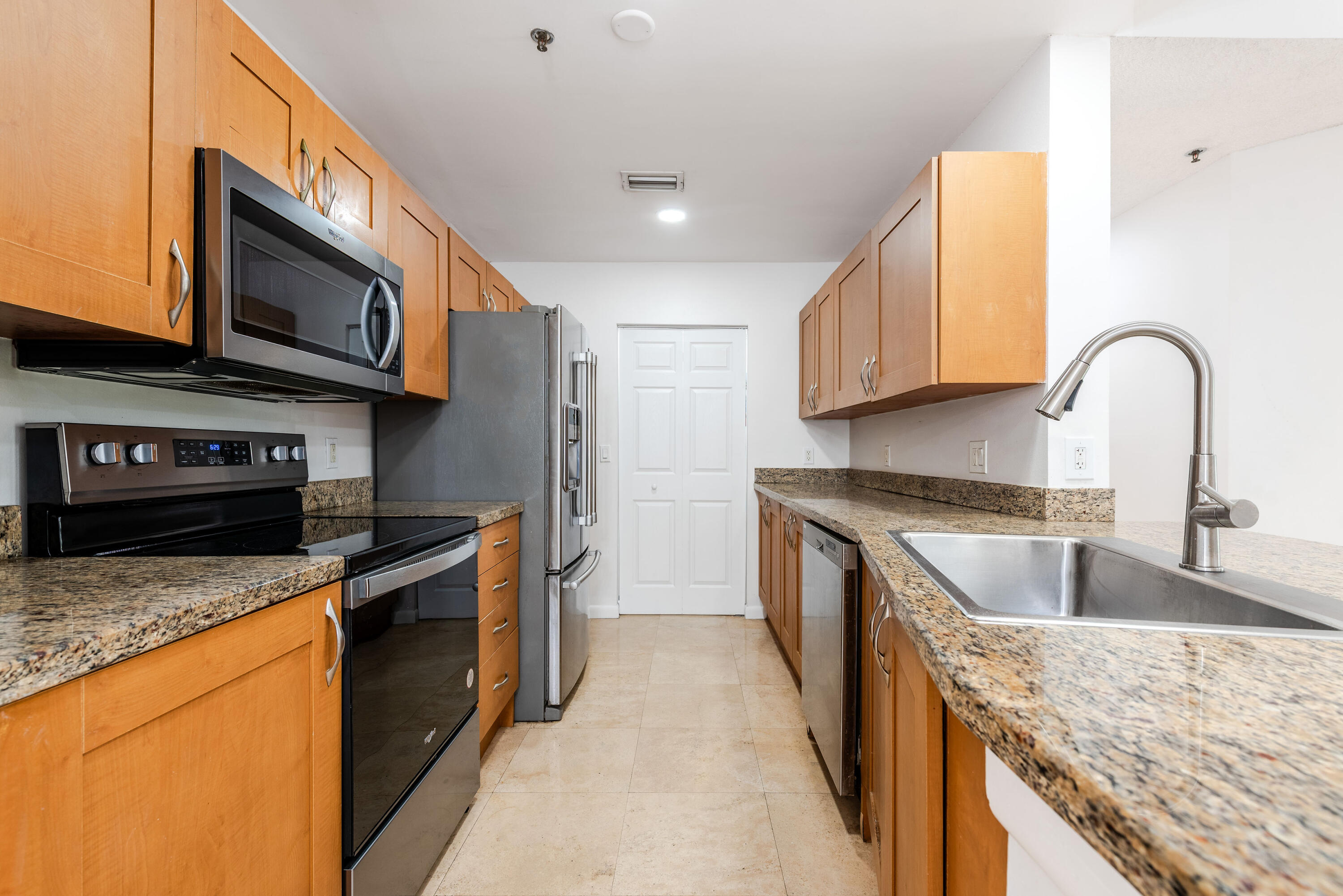 3153 Clint Moore Road, Unit 201 Boca Raton, FL 33496 - Photo 10 of 41 Cabinetry and Stainless appliances