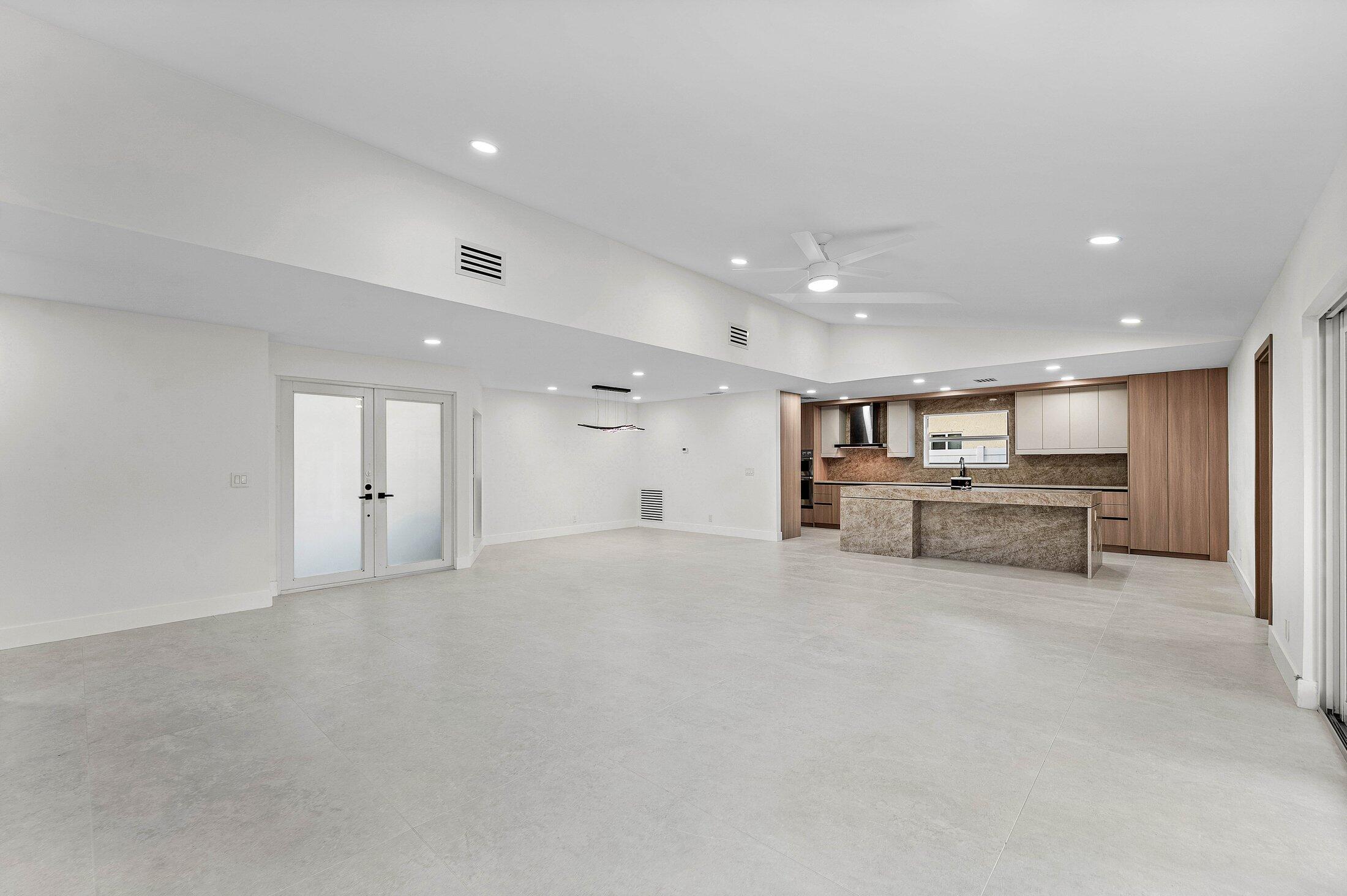 1380 Southwest 1st Street Boca Raton, FL 33486 - Photo 16 of 50 a view of kitchen and a refrigerator in a room