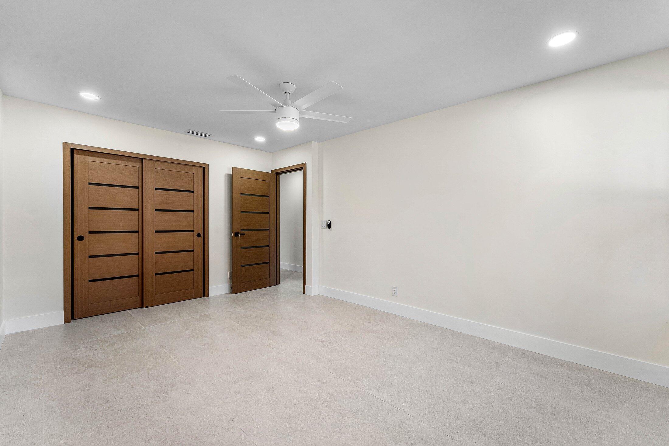 1380 Southwest 1st Street Boca Raton, FL 33486 - Photo 19 of 50 a view of an empty room with a ceiling fan