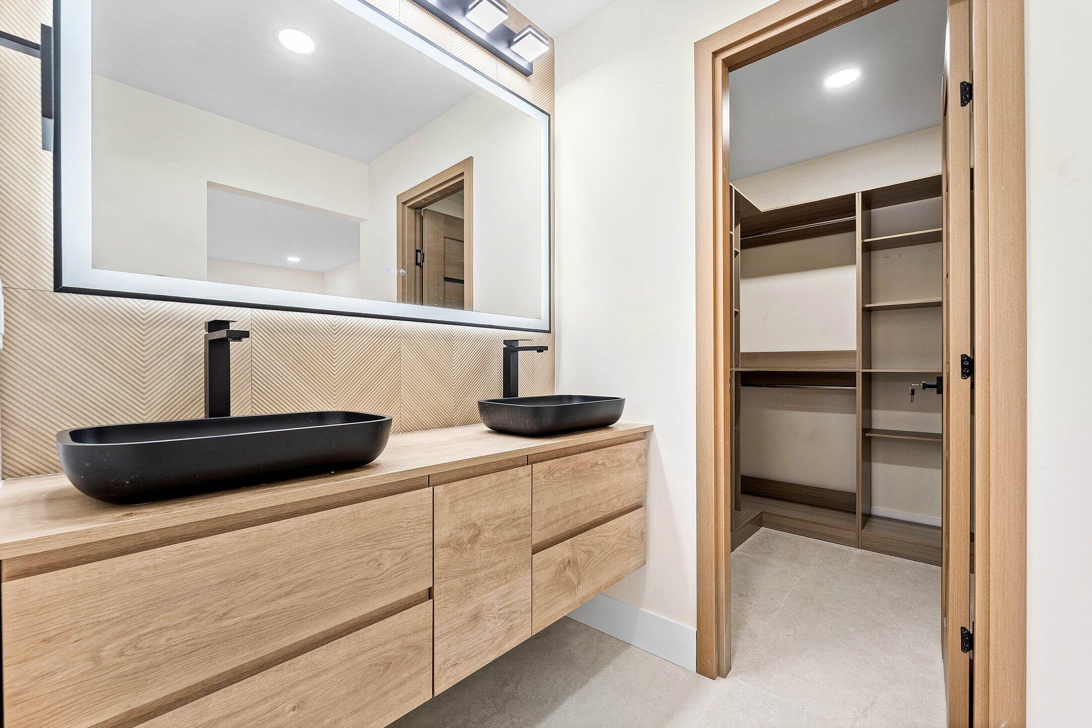 1380 Southwest 1st Street Boca Raton, FL 33486 - Photo 28 of 50 a bathroom with a sink and a mirror