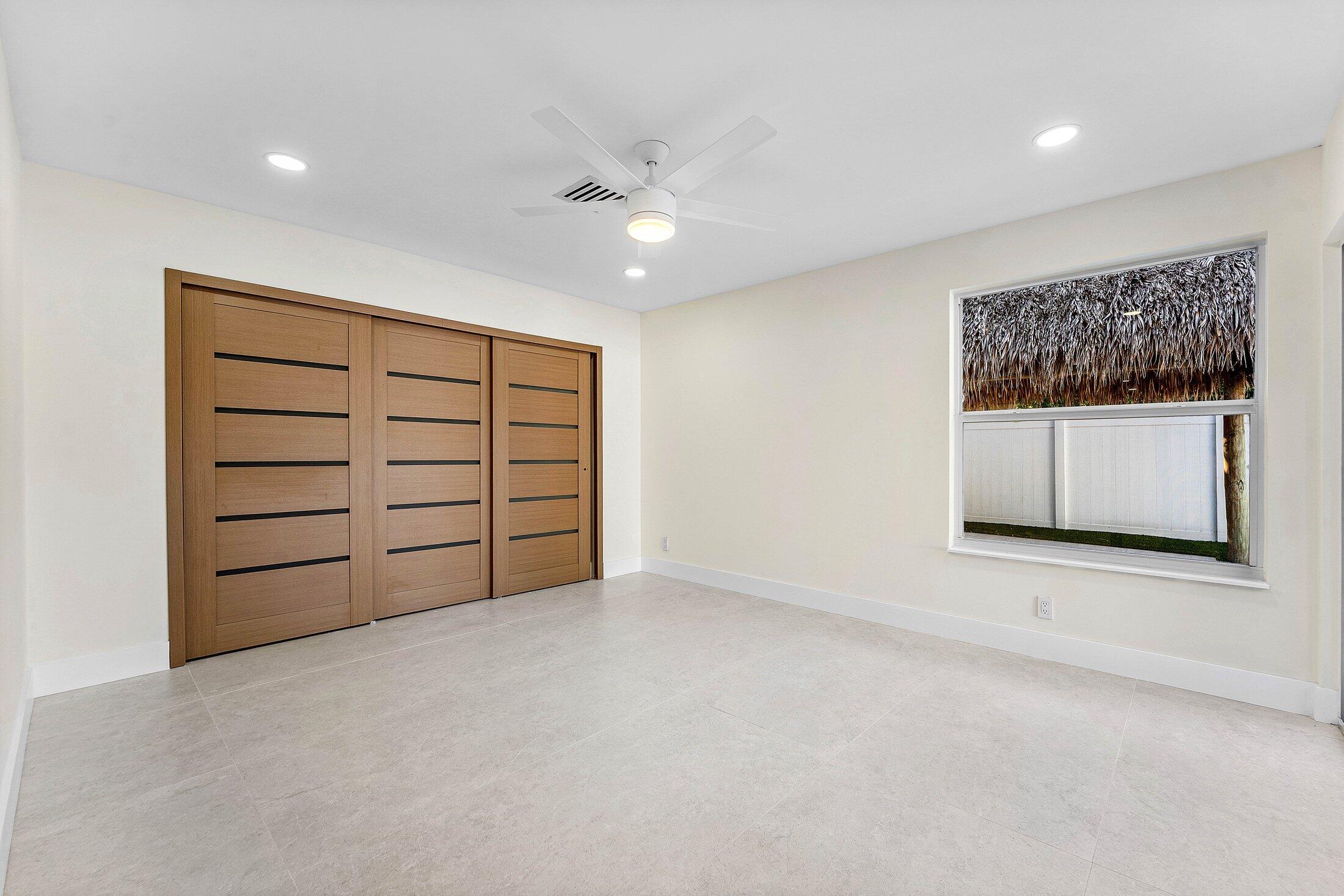 1380 Southwest 1st Street Boca Raton, FL 33486 - Photo 30 of 50 a view of an empty room with a cabinet