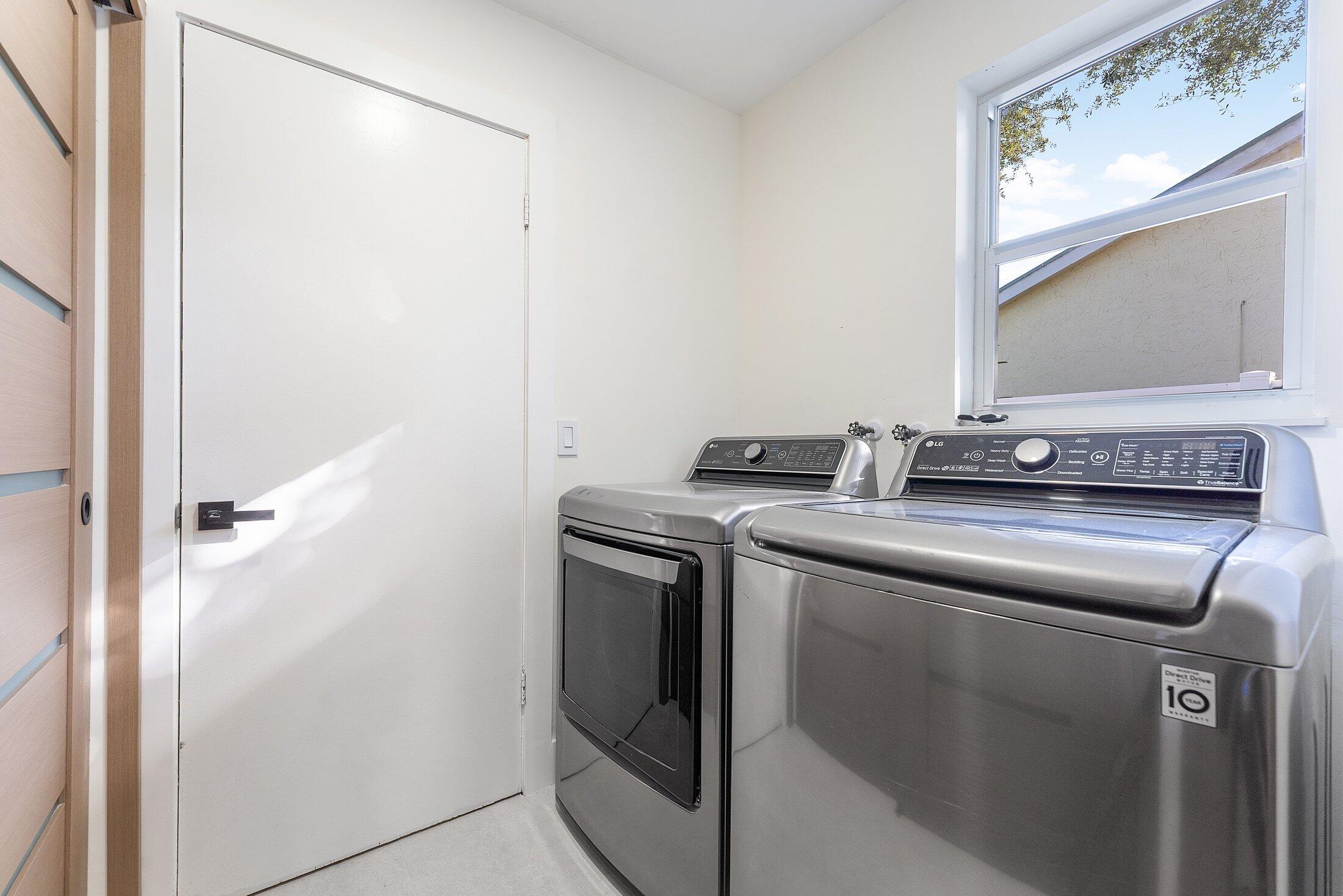 1380 Southwest 1st Street Boca Raton, FL 33486 - Photo 32 of 50 a view of a utility room with washer and dryer