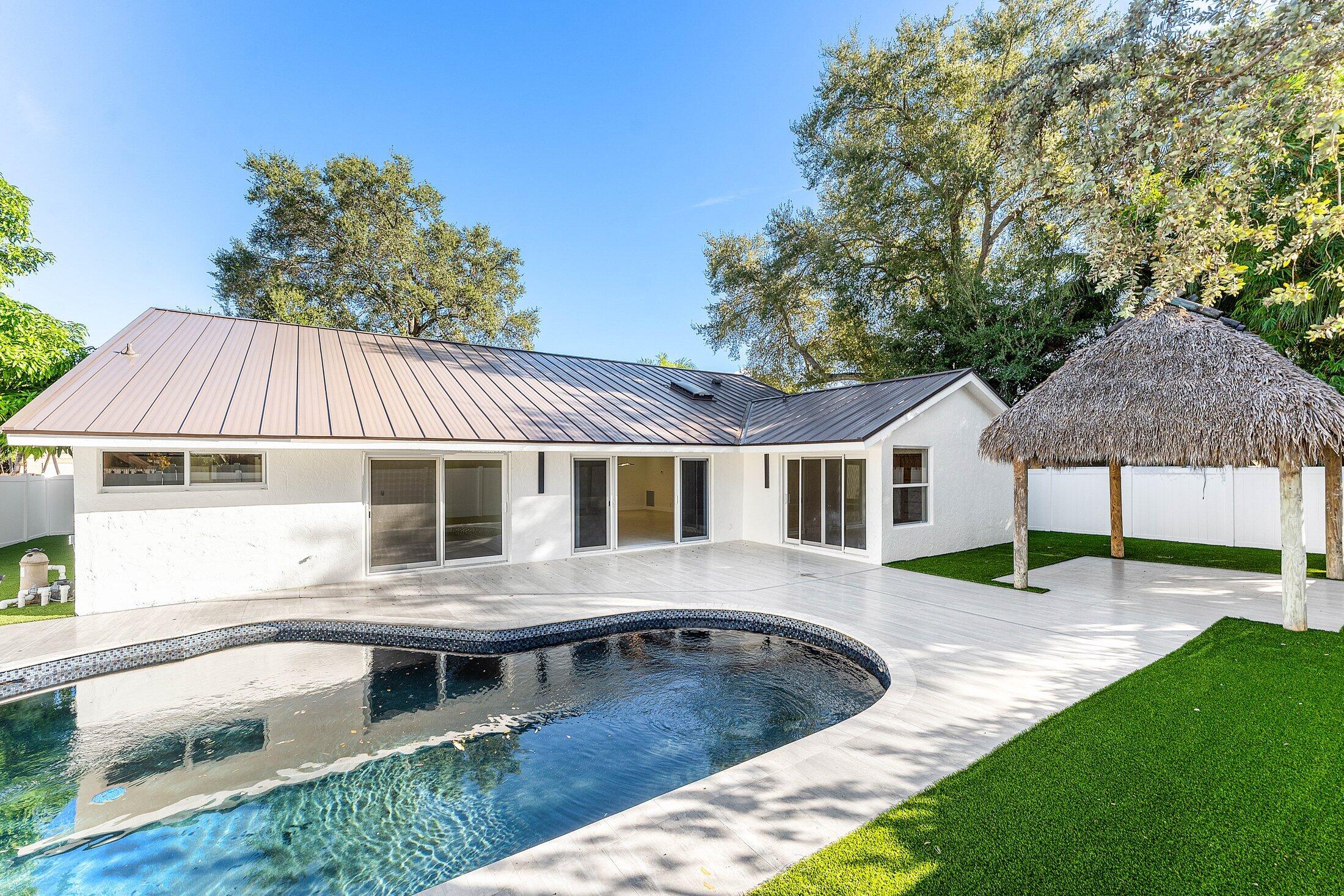 1380 Southwest 1st Street Boca Raton, FL 33486 - Photo 37 of 50 a front view of a house with garden