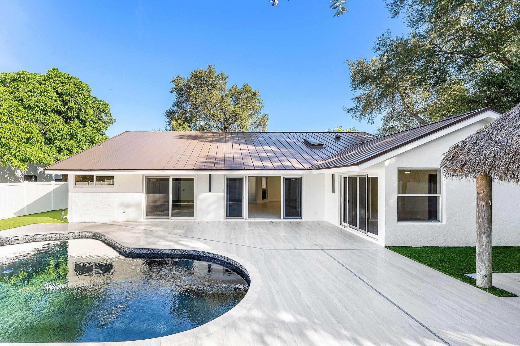 1380 Southwest 1st Street Boca Raton, FL 33486 - Photo 38 of 50 a view of a house with pool