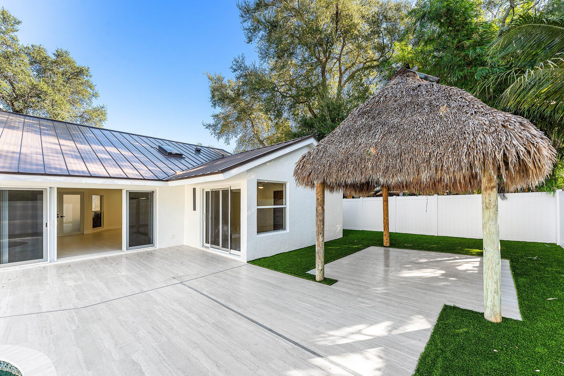 1380 Southwest 1st Street Boca Raton, FL 33486 - Photo 40 of 50 a view of a house with backyard and trees