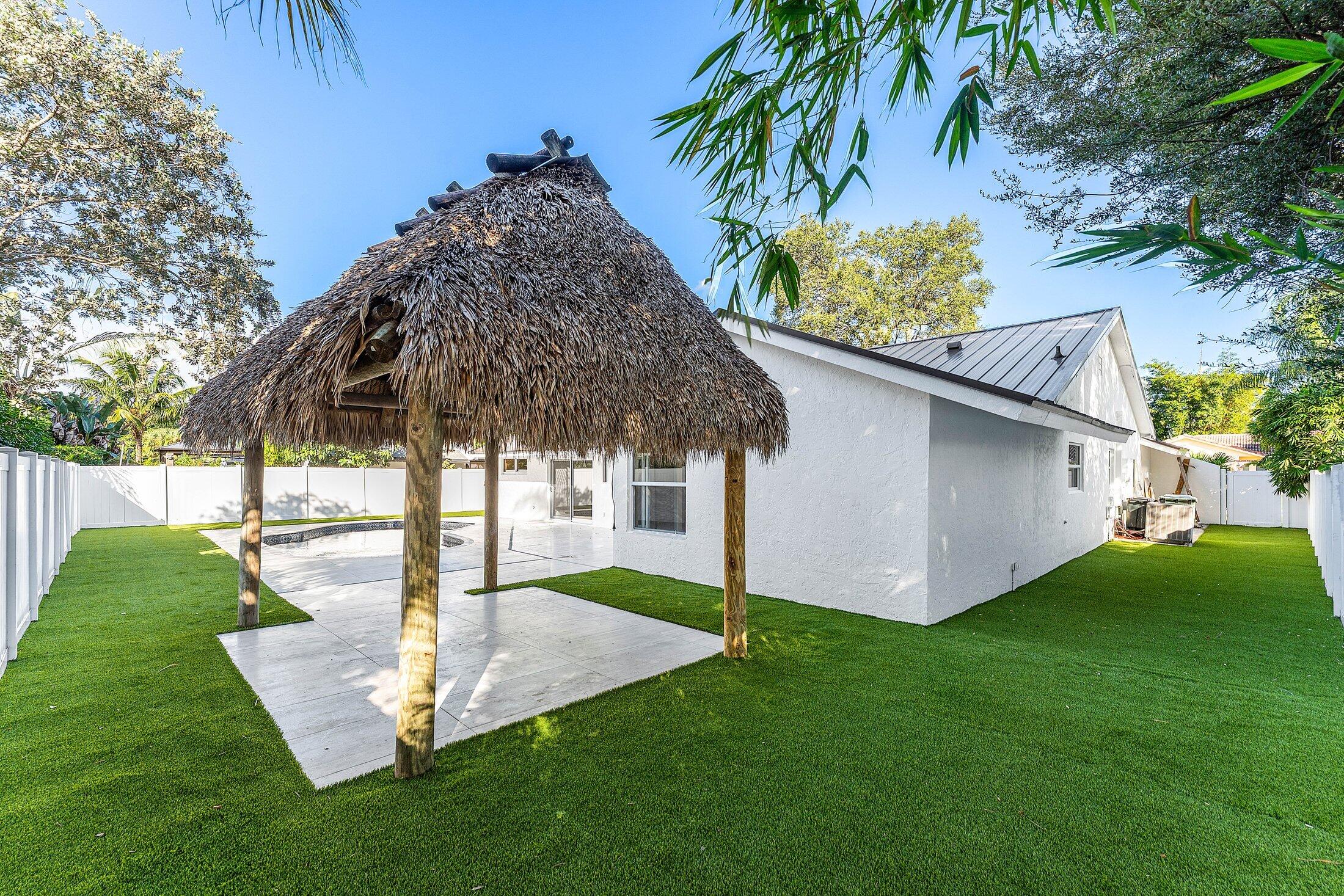 1380 Southwest 1st Street Boca Raton, FL 33486 - Photo 41 of 50 a view of a house with a yard