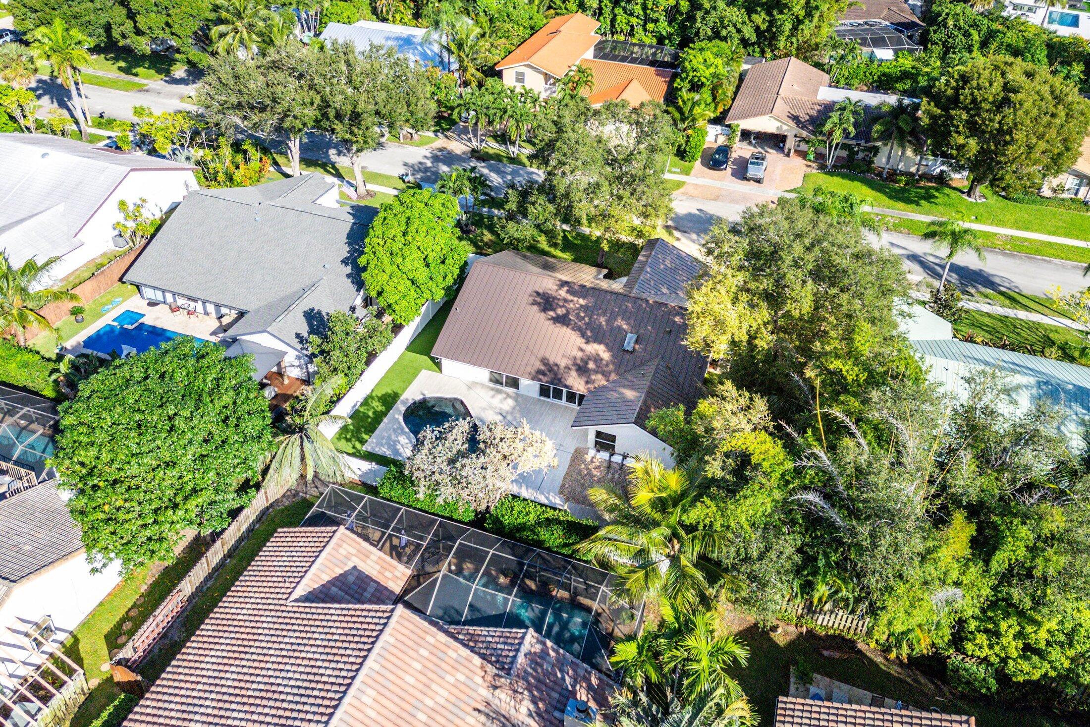1380 Southwest 1st Street Boca Raton, FL 33486 - Photo 45 of 50 an aerial view of a house with a yard and garden