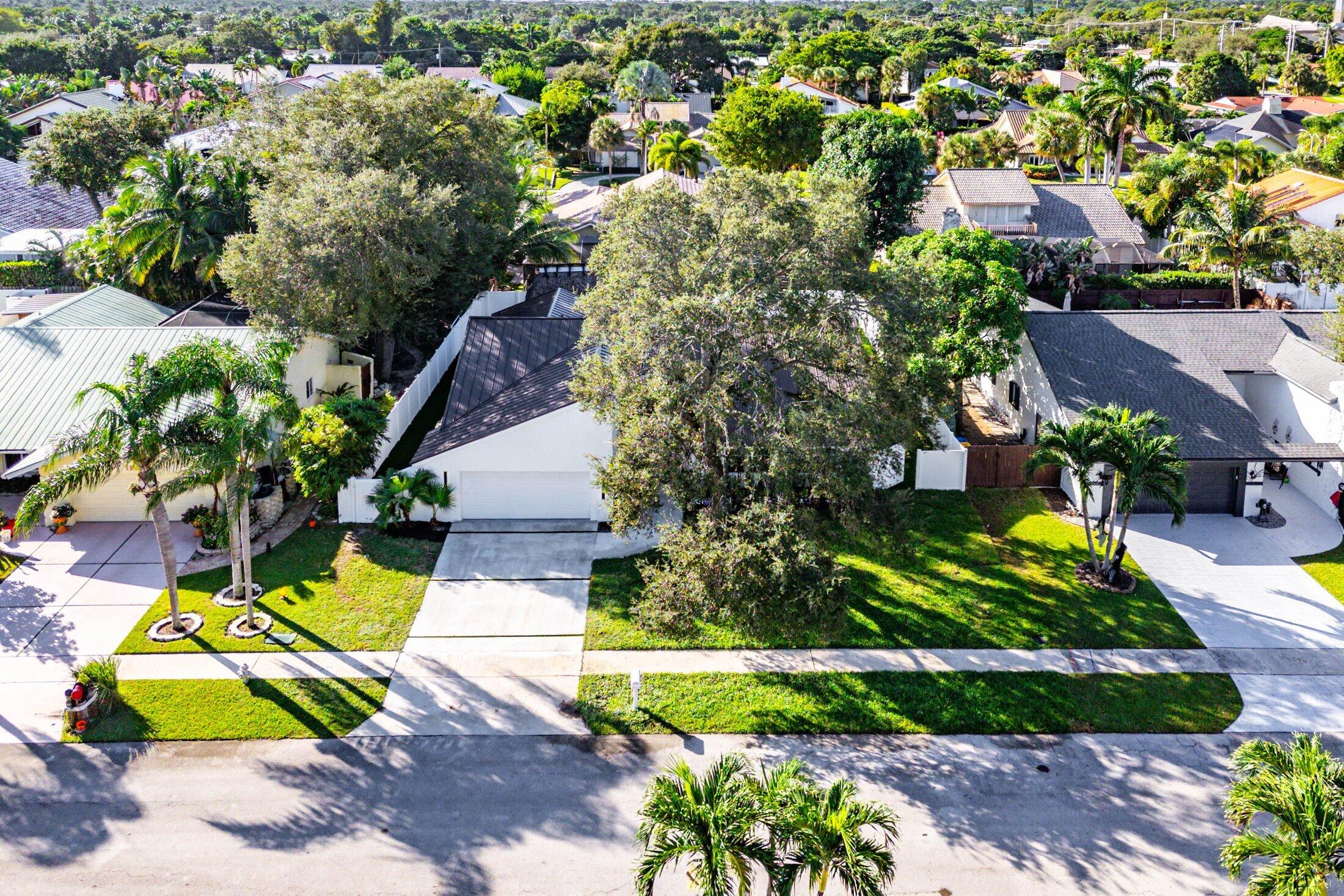 1380 Southwest 1st Street Boca Raton, FL 33486 - Photo 48 of 50 an aerial view of a house with swimming pool and garden