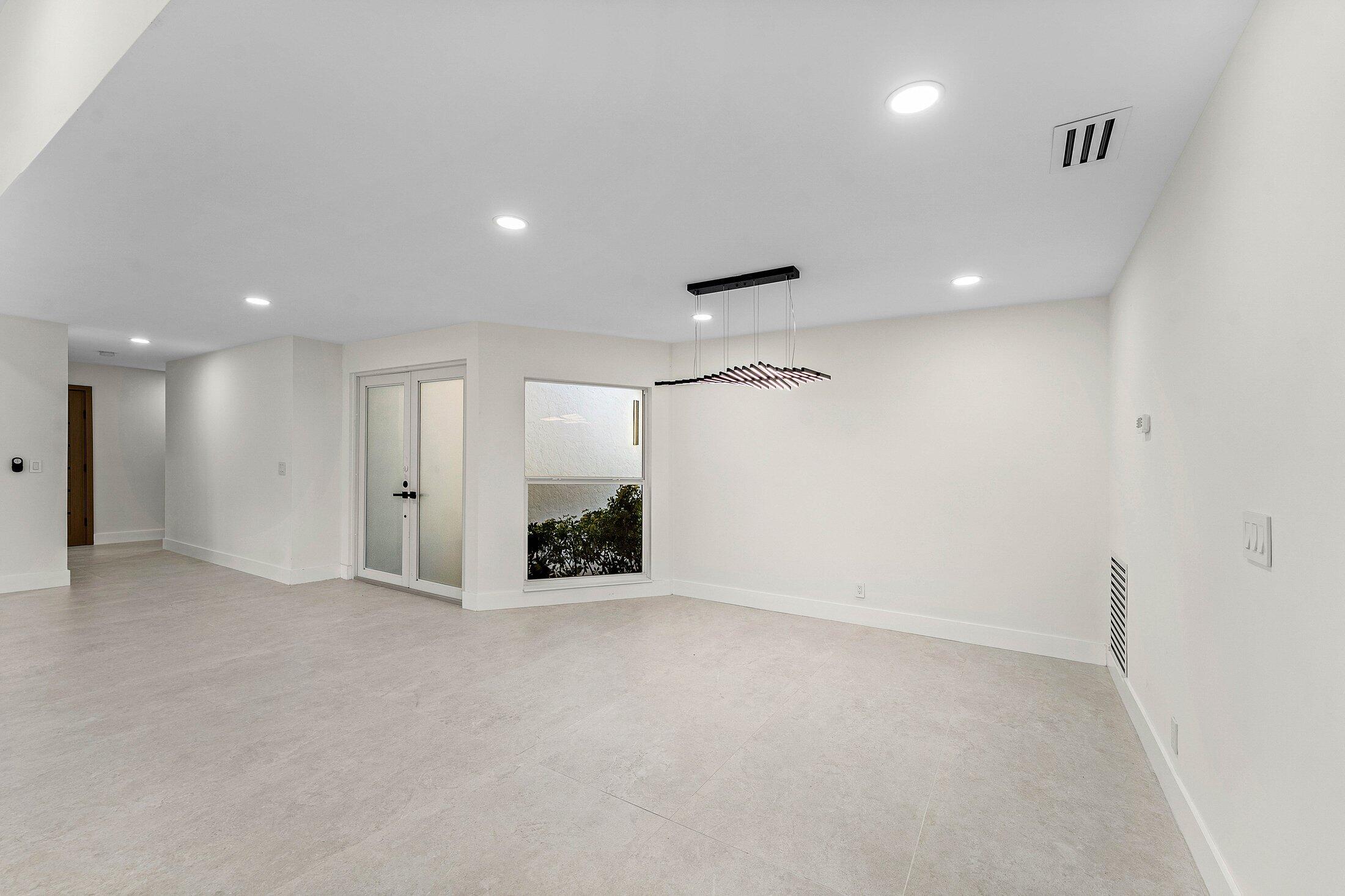 1380 Southwest 1st Street Boca Raton, FL 33486 - Photo 6 of 50 an empty room with window and pillar in it