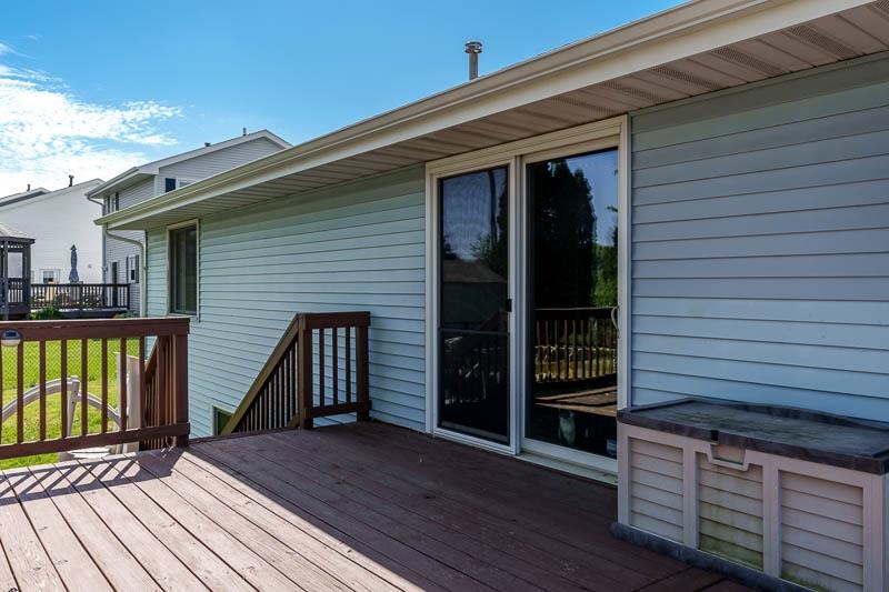 5406 Torque Road Loves Park, IL 61111 - Photo 11 of 40 a view of a house with a deck