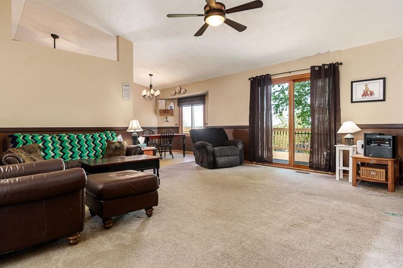 5406 Torque Road Loves Park, IL 61111 - Photo 12 of 40 a living room with furniture and a flat screen tv