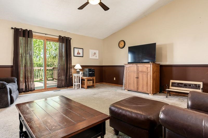 5406 Torque Road Loves Park, IL 61111 - Photo 13 of 40 a living room with furniture and a flat screen tv