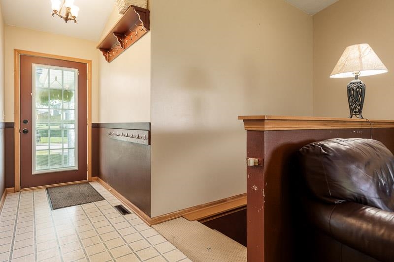 5406 Torque Road Loves Park, IL 61111 - Photo 14 of 40 a view of a bedroom with bed and hallway