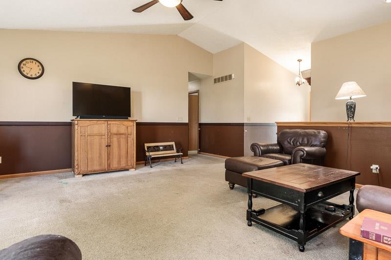 5406 Torque Road Loves Park, IL 61111 - Photo 16 of 40 a living room with furniture and a flat screen tv