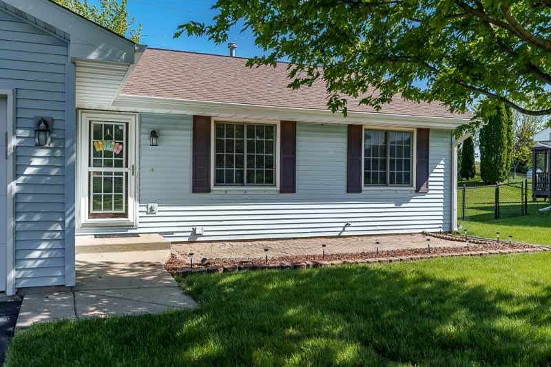 5406 Torque Road Loves Park, IL 61111 - Photo 3 of 40 a front view of a house with a yard
