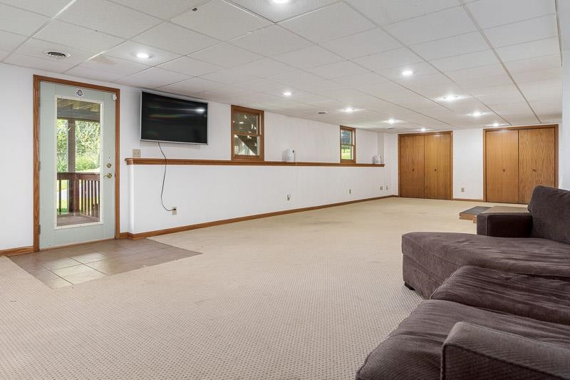 5406 Torque Road Loves Park, IL 61111 - Photo 34 of 40 a living room with furniture and a flat screen tv