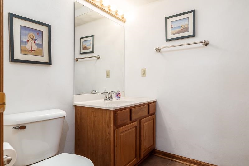 5406 Torque Road Loves Park, IL 61111 - Photo 40 of 40 a bathroom with a toilet a sink and mirror