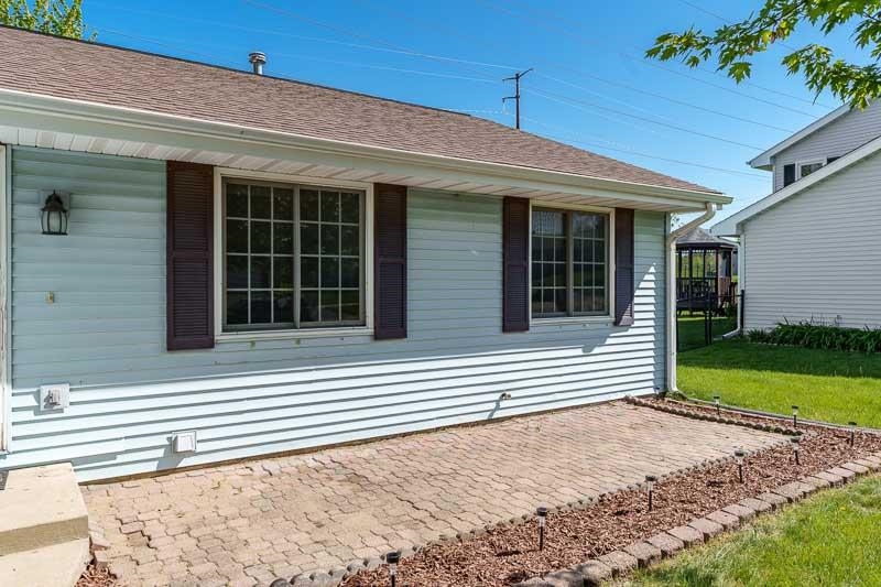 5406 Torque Road Loves Park, IL 61111 - Photo 4 of 40 a front view of a house with a yard