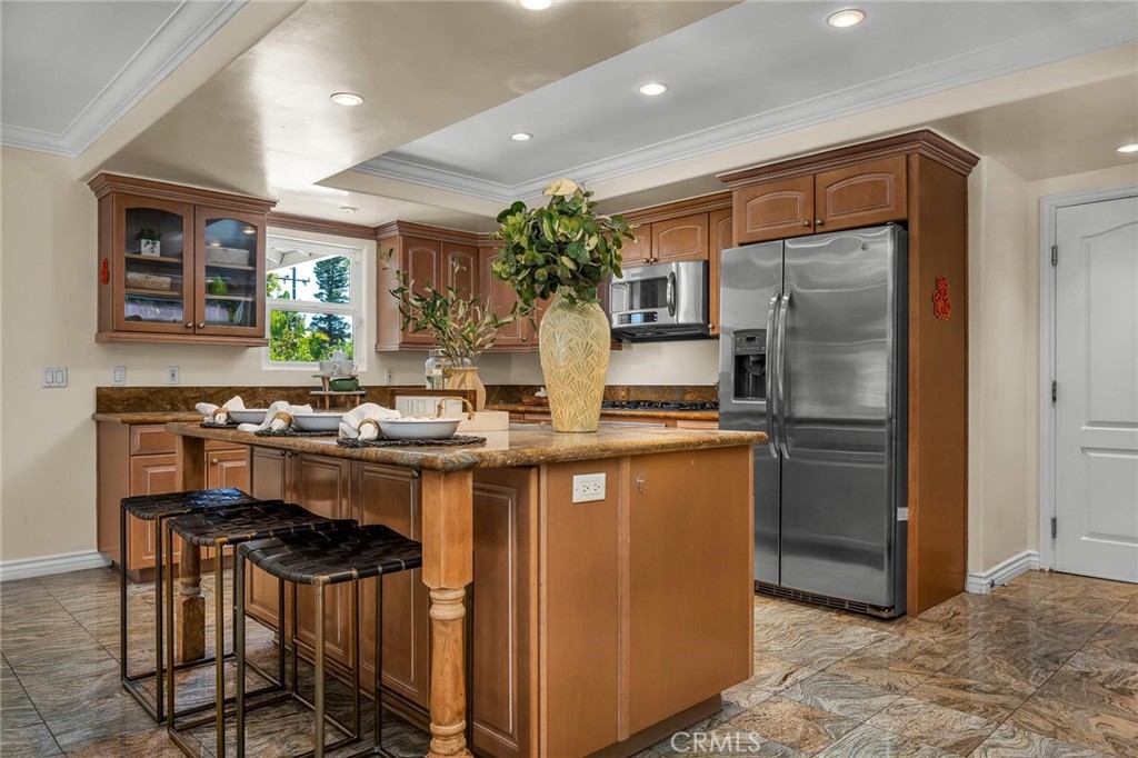28084 Ella Road Rancho Palos Verdes, CA 90275 - Photo 12 of 38 a kitchen with stainless steel appliances a sink and a refrigerator