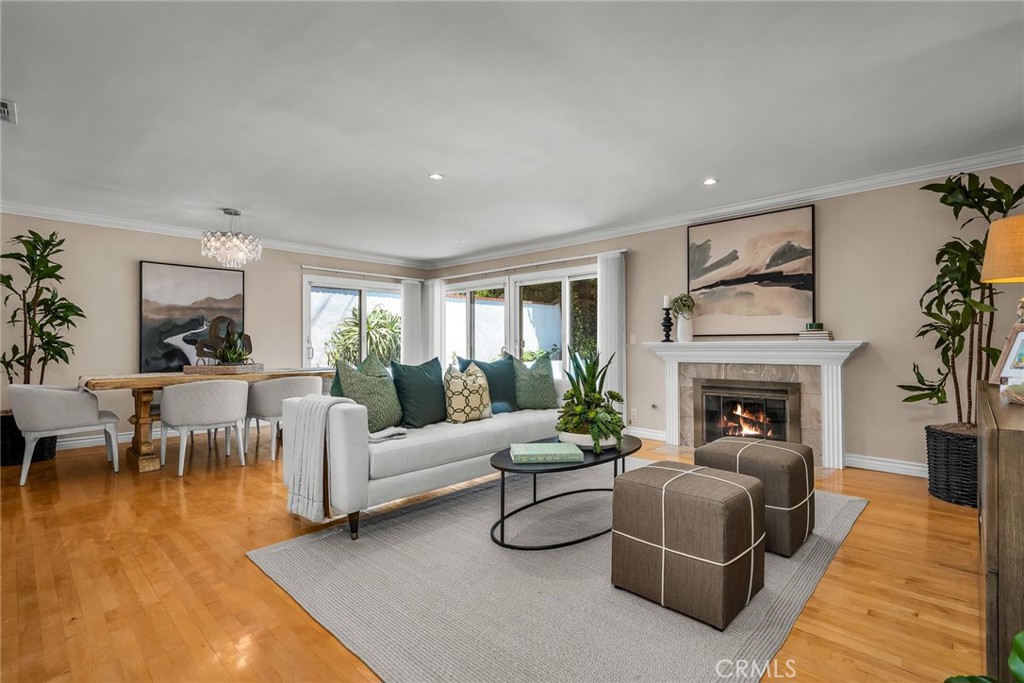 28084 Ella Road Rancho Palos Verdes, CA 90275 - Photo 4 of 38 a living room with furniture potted plant and a fireplace