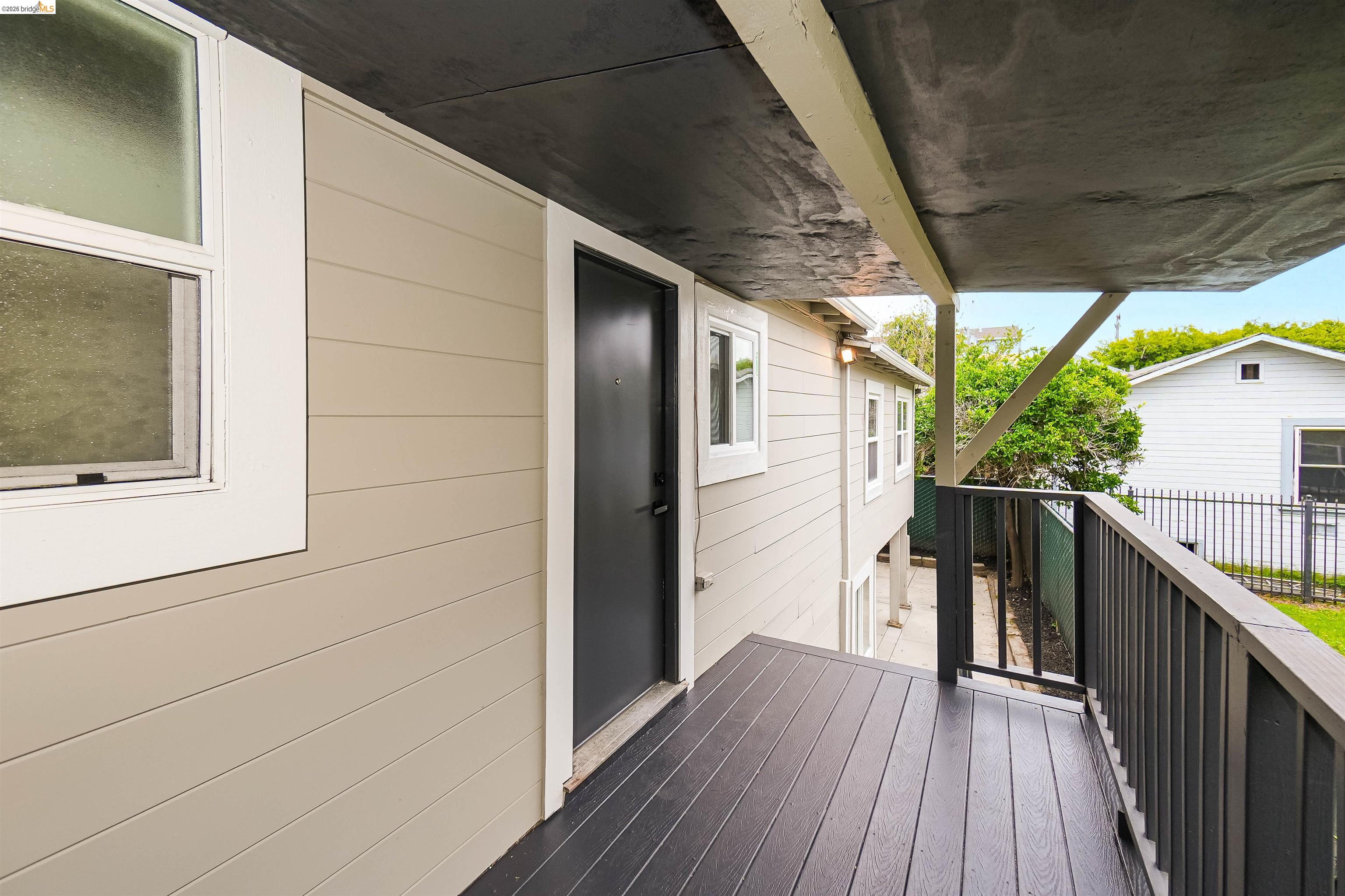 1812 Woolsey Street Berkeley, CA 94703 - Photo 25 of 48 Covered porch featuring dark wood-finish decking and dark railing