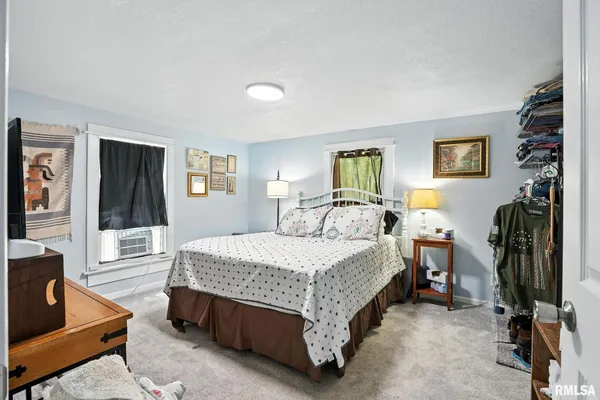 a bed room with a bed and furniture
