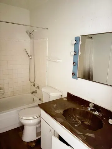 a bathroom with a shower and a tub
