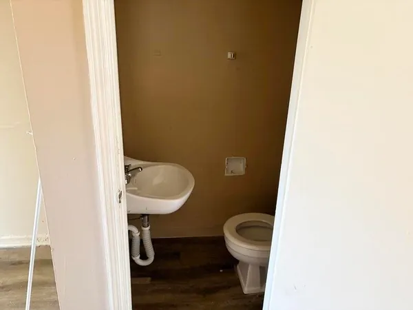 a bathroom with a toilet and a sink