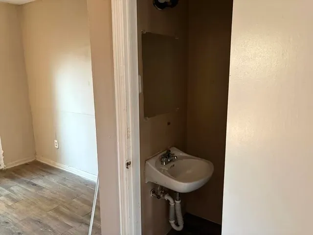 a bathroom with a sink and mirror