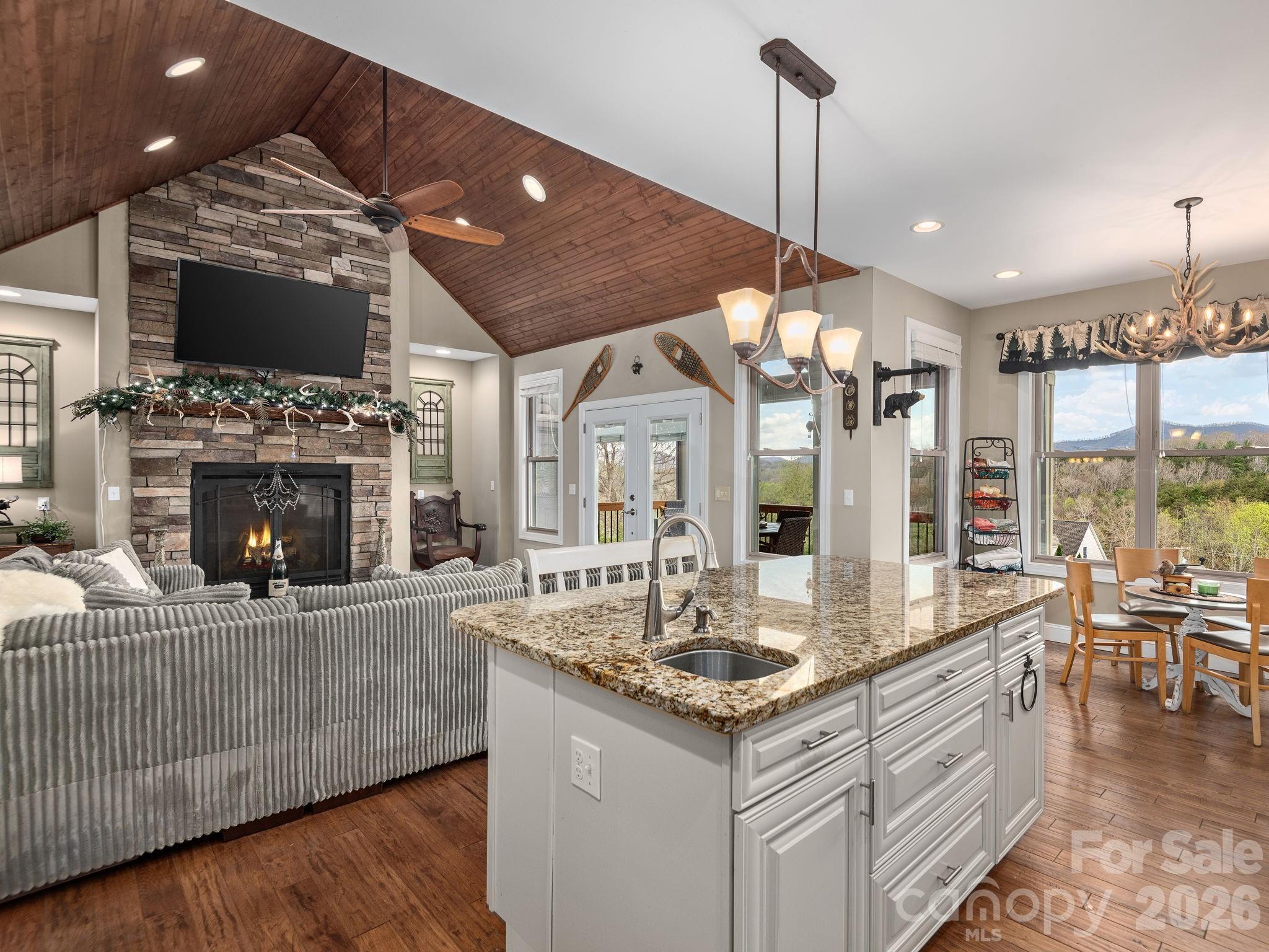 193 Youngs Cove Road Candler, NC 28715 - Photo 13 of 48 a living room with fireplace furniture and a flat screen tv