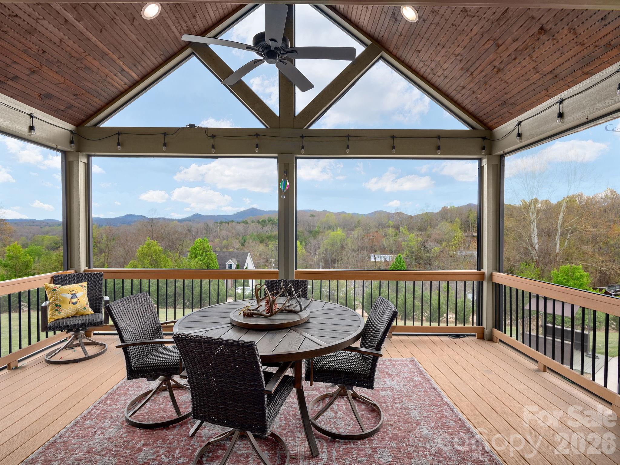 193 Youngs Cove Road Candler, NC 28715 - Photo 17 of 48 a view of a patio on the roof deck