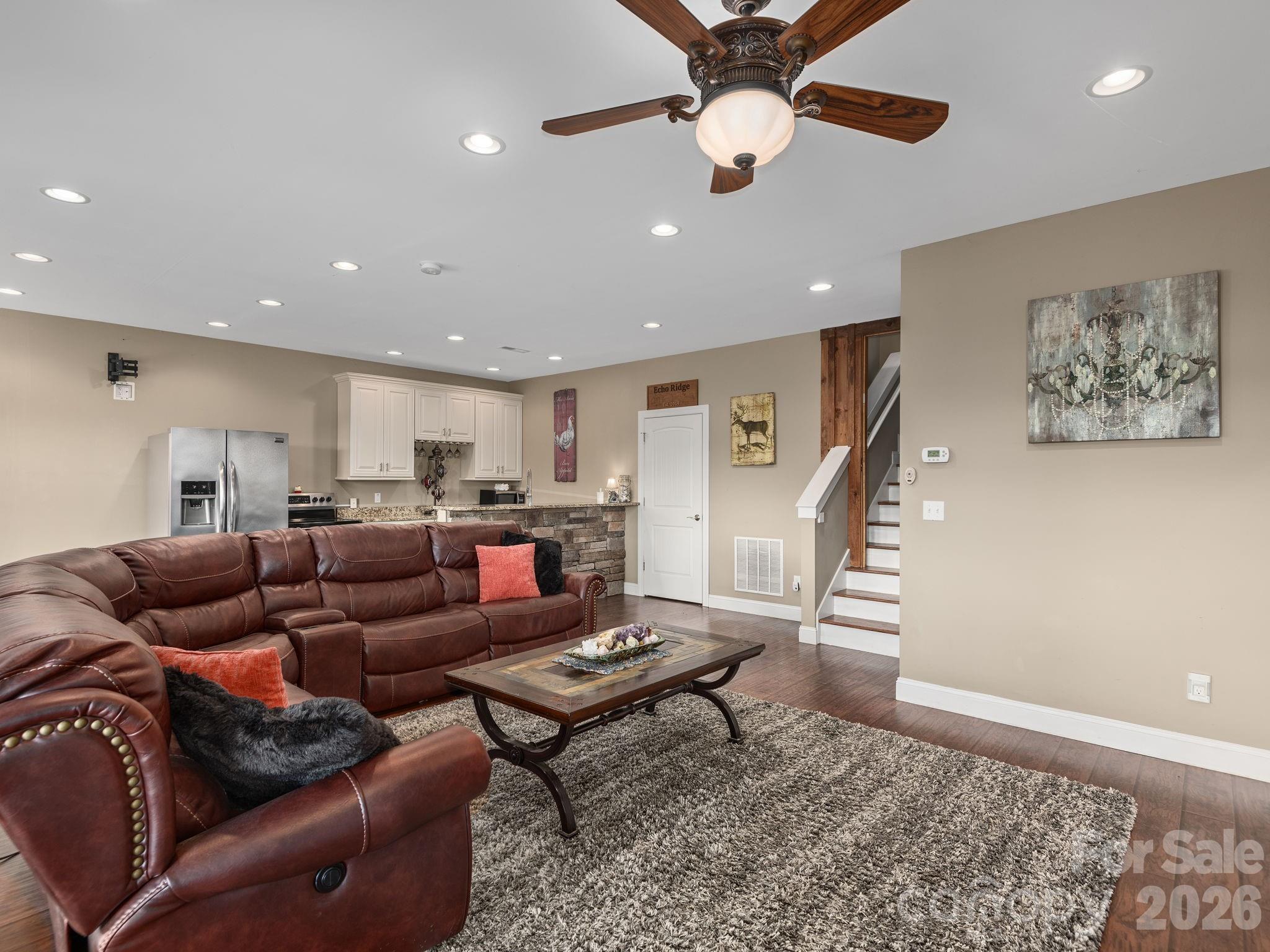 193 Youngs Cove Road Candler, NC 28715 - Photo 26 of 48 a living room with furniture and wooden floor