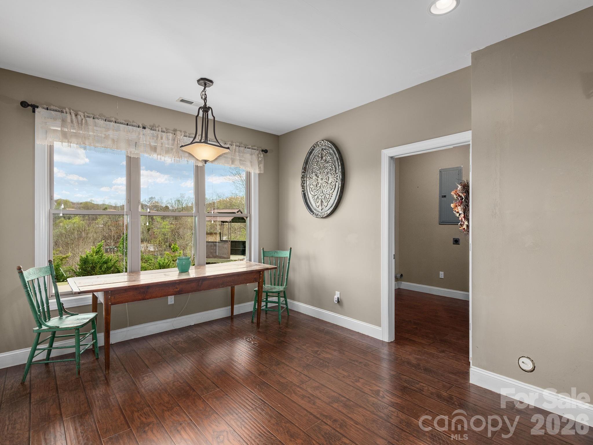 193 Youngs Cove Road Candler, NC 28715 - Photo 29 of 48 a living room with furniture and a large window