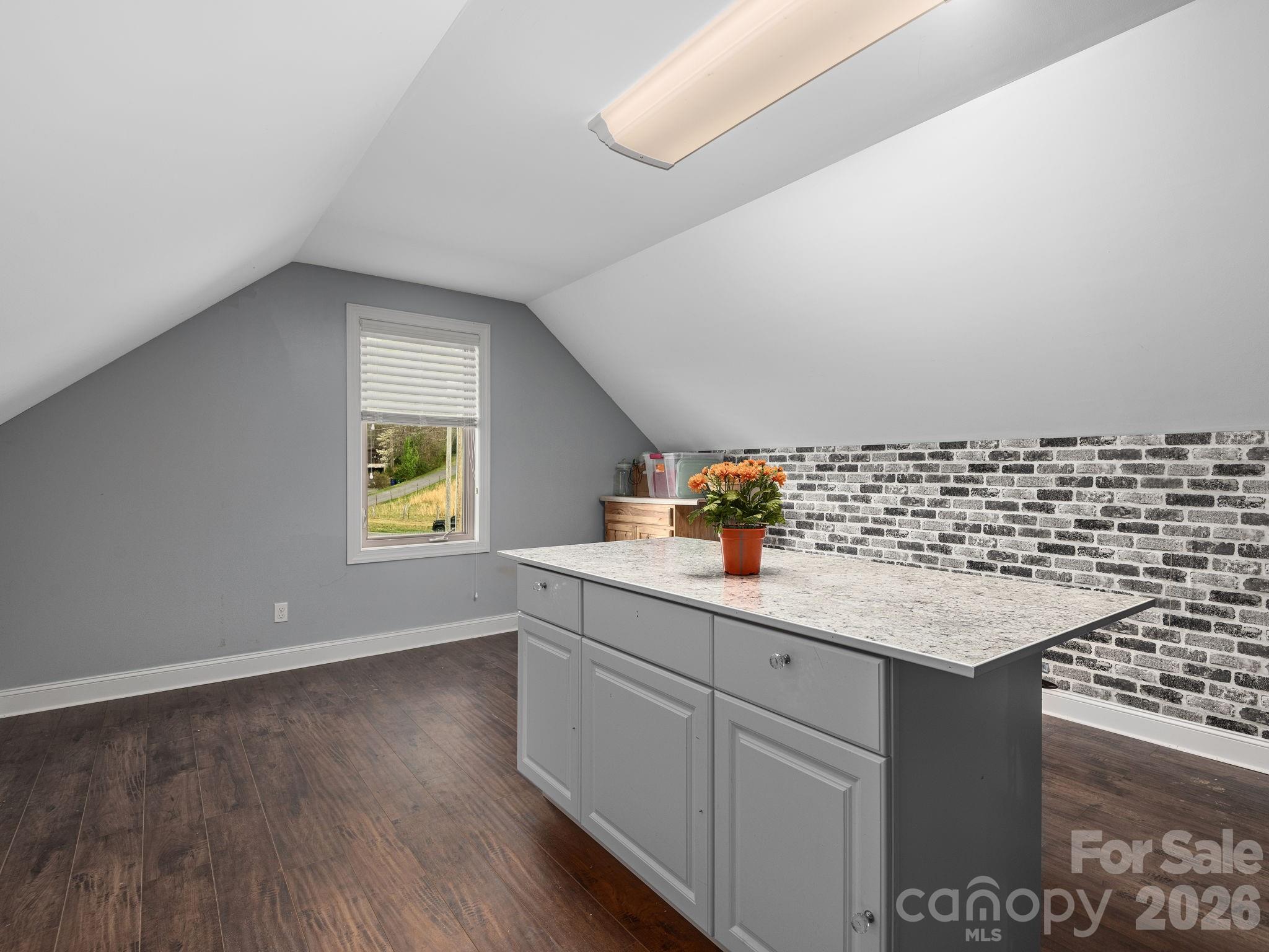193 Youngs Cove Road Candler, NC 28715 - Photo 35 of 48 a kitchen with a sink cabinets and wooden floor